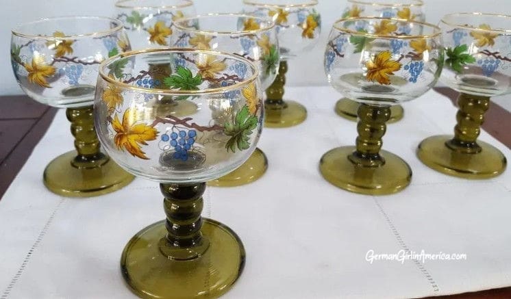 green stemmed wine glasses