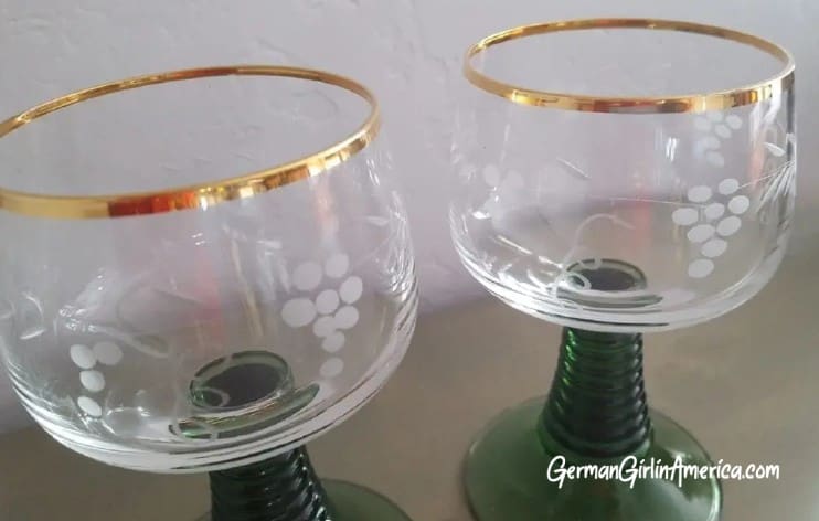 green stemmed wine glasses